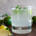 short glass filled with a sparkling lime drink