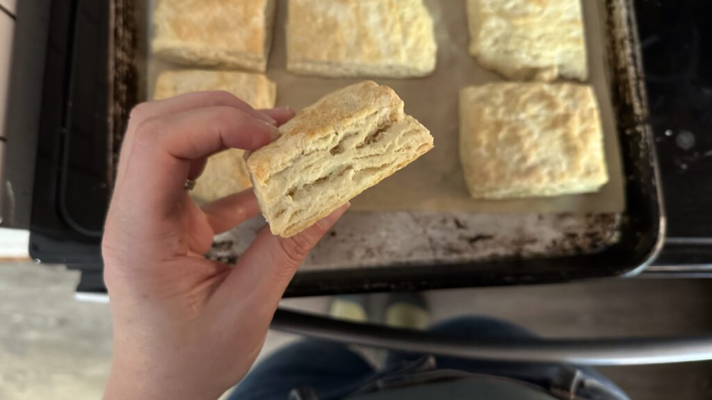 hand holding a sourdough biscuit